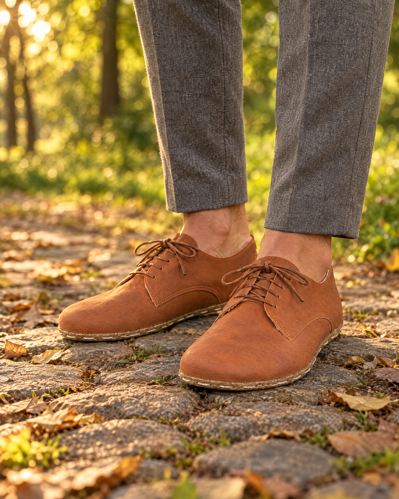 Barefoot oxford shoes on a cobblestone park path